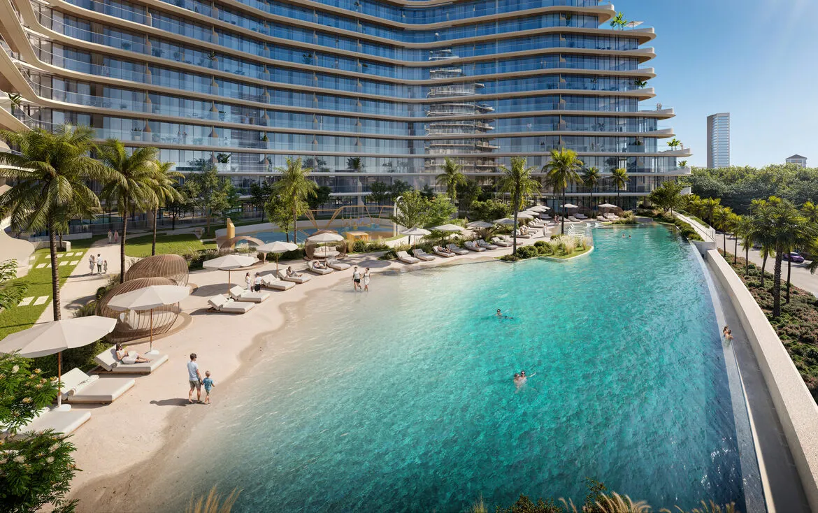 Luxurious desert architecture high-rise featuring a man-made beach and lagoon-style pool, surrounded by palm trees and tropical landscaping.